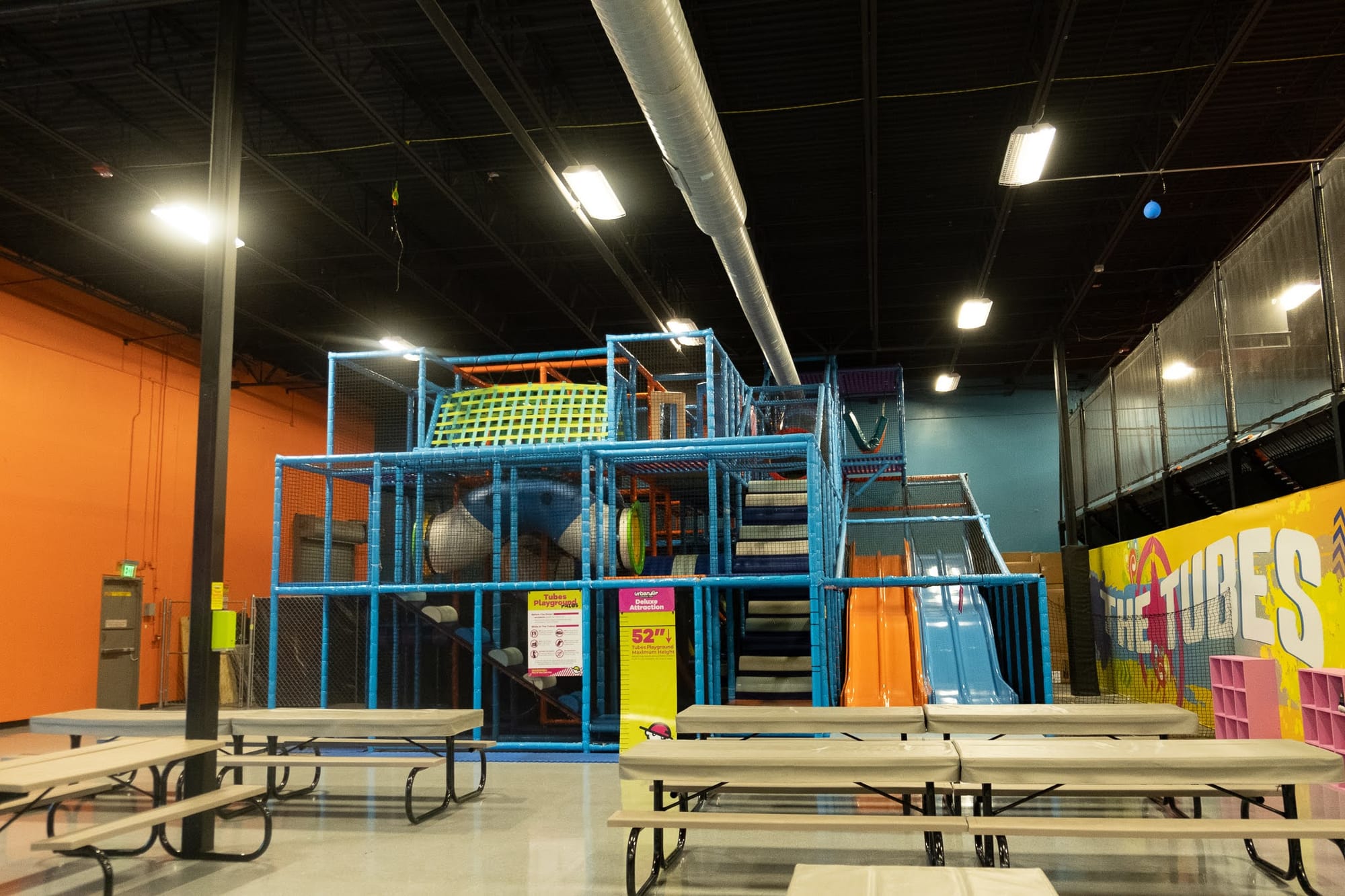 A colorful three-story kids playscape inside Urban Air Trampoline Park in Waco, Texas