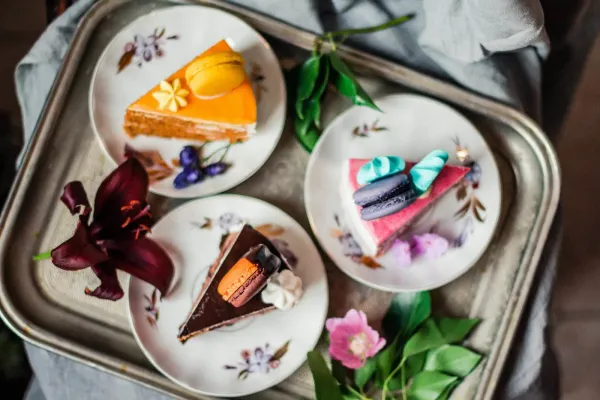 colorful pieces of cakes with macarons