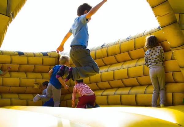 kid bouncing on one of the bounce house rentals in Waco