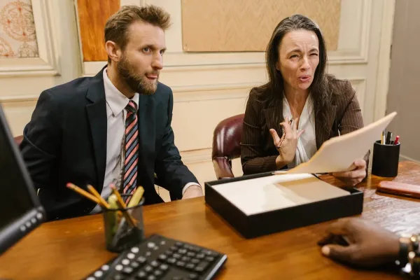 man people woman desk