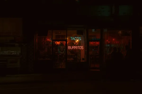 neon Tacos and Burritos sign on tex-mex restaurant window