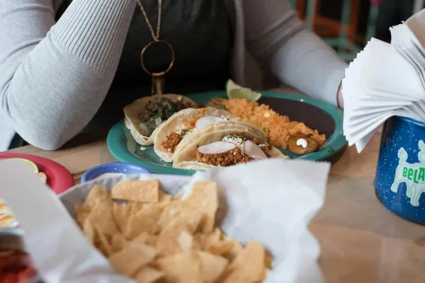 a plate of tex-mex food sitting on a table in a tex-mex restaurant